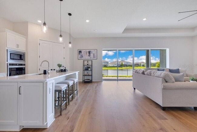 Photo - Waterfront Luxury in Isles of Lake Nona | 3-Car Garage, Resort Amenities & HOA-Included Cable, In...