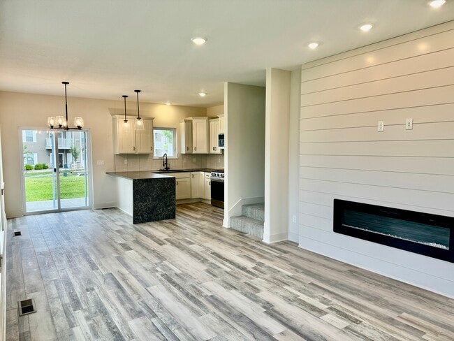 Living room looking towards kitchen - 22914 W 72nd Ter Townhome