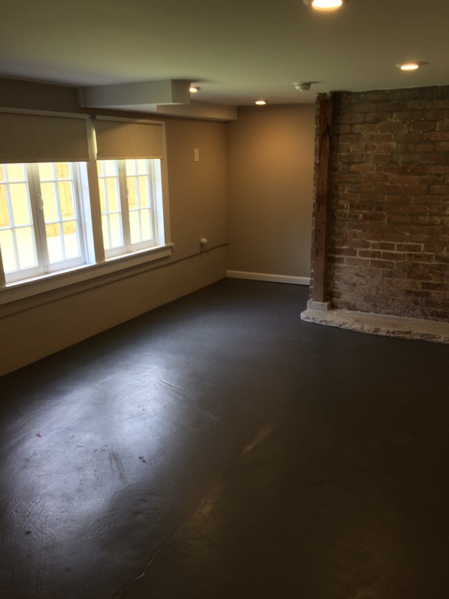 Bedroom wtih brick and walk in closet - 8329 Pritchard Pl Unit B