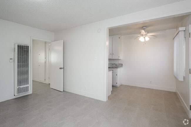 1BR, 1BA - 600SF - Living Room and Dining Room - Palm Court Apartments