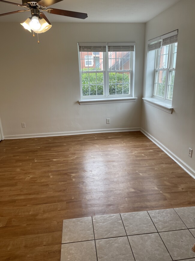 Large living space with ceiling fan and natural light - 2000 Central Ave Apartments Unit 1