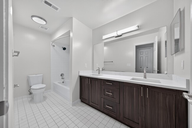 Modern bathroom with tub at Franklin River Apartments in Southfield, MI.