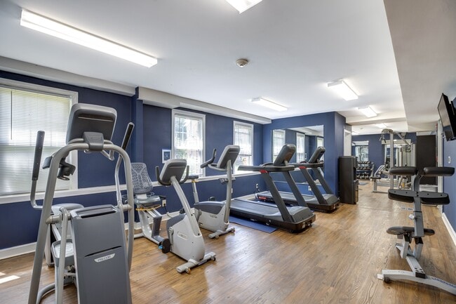 a gym with cardio equipment and treadmills at Park Crest Apartments, District of Columbia 20007