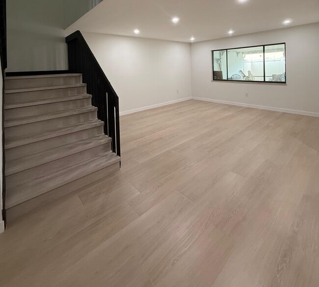 Living Room and Stairs - 5347 Emerald Isle Dr