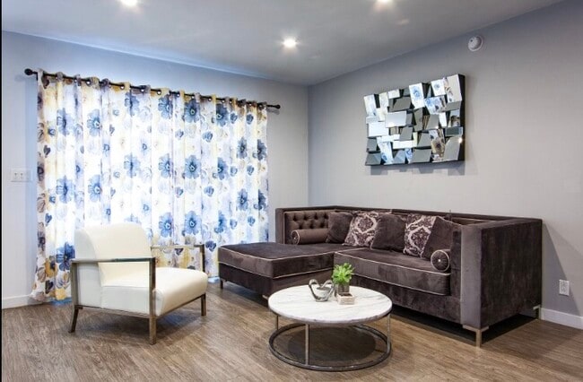 Living Room with Double paned balcony doors - The Runyon Apartments