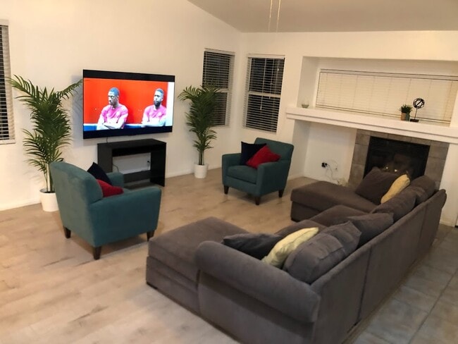 Living room with 75" flat screen TV for kicking back and watching your favorite streaming shows and