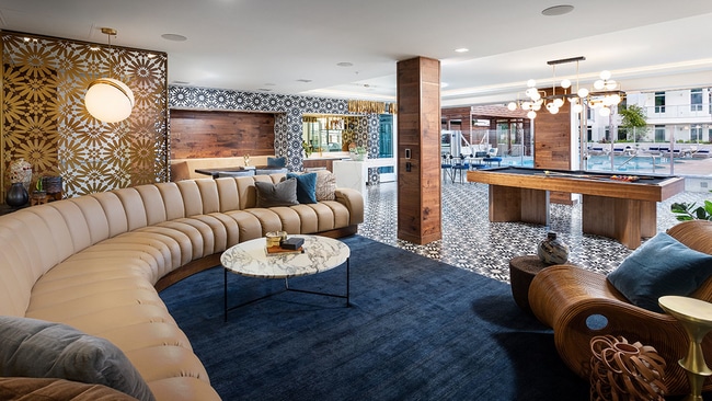 Clubroom with gaming area including billiards and expansive gathering areas