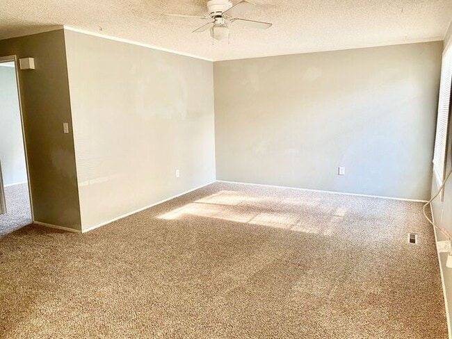 Photo - Spacious 3 Bedroom 1 Bath Duplex in South Loveland with Huge Fenced Backyard & 2-Car Garage!