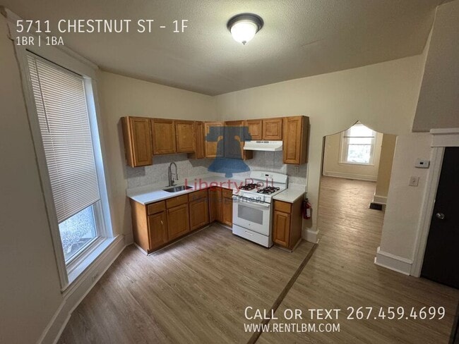 Building Photo - 5711 Chestnut St Unit 1F Rental