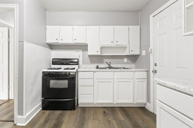 Photo - This updated 4-bedroom, 1-bath home is rea...