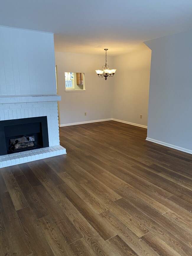 Living room with gas fireplace looking into the dining area - 632 Northview Ave Townhome