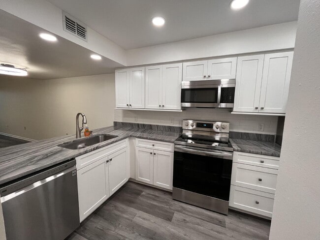 Photo - Two-story condominium, featuring 2 bedrooms and 2 1/2 bathrooms