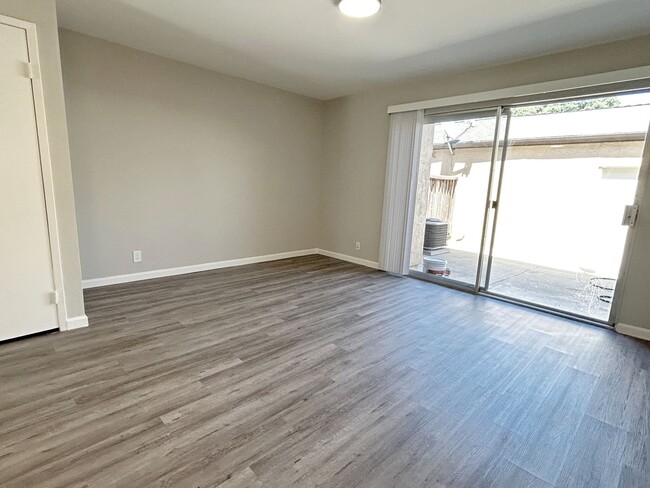 Photo - Move-in ready Evergreen townhome with private backyard, detached 2-car garage, and great communit...