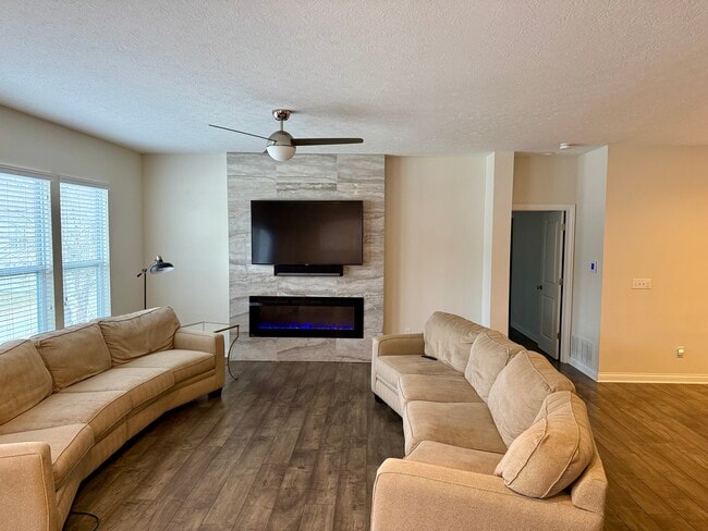 Living Room w/ TV & Fireplace - 6120 Jadkins Way Unit Jadkins