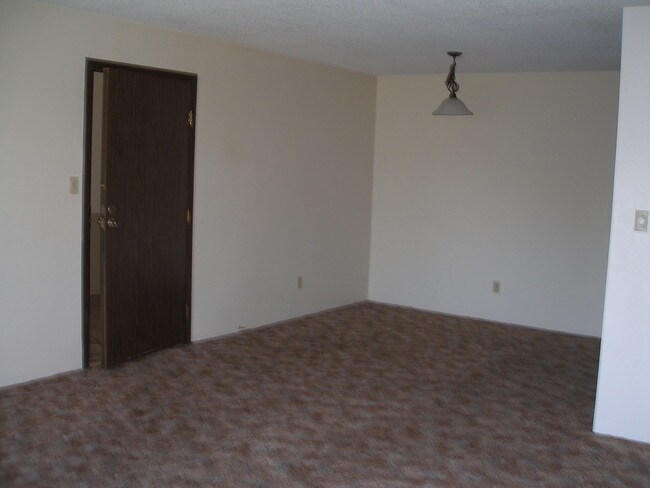 Living Room/Dining Room - Acres Apartments