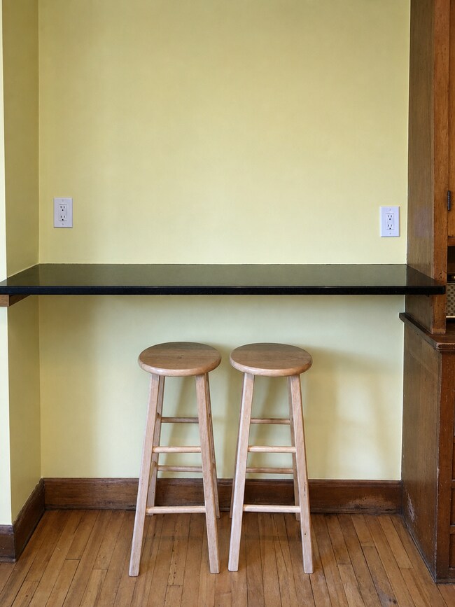 Granite kitchen bar with seating for two. - 3254 15th Ave S Unit 1S