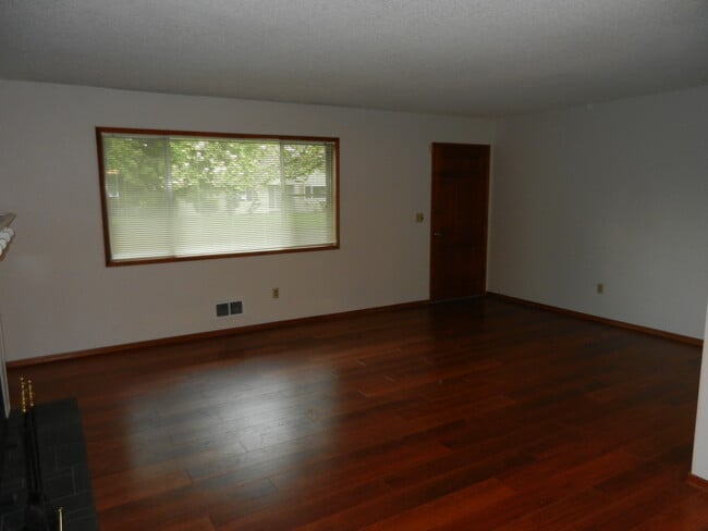 Photo - Well-Located Home with Fireplace, Fenced Yard & 2-Car Garage