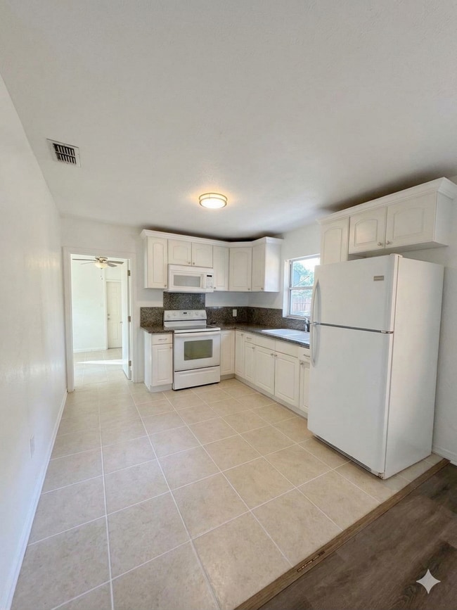 Photo - Newly Remodeled 3BR Home in Coquina Key – Large Yard with Dual Side Access