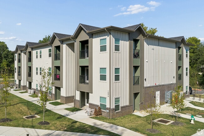 Three-story building with landscaped grounds