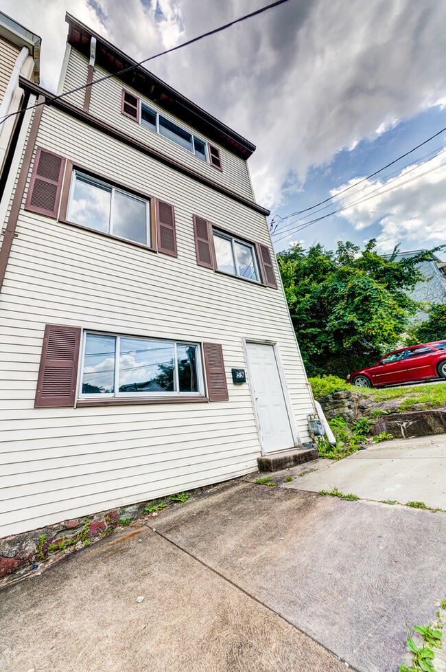 Photo - AVAILABLE AUGUST 2026 - Beautiful 3 Bedroom Home w/ OFF-STREET PARKING & Deck!