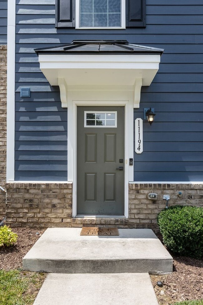 Photo - Luxurious three-story townhome with owner's suite and high-end finishes