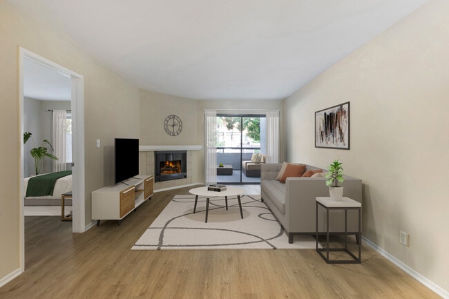 Renovated Package II living room with hard surface flooring