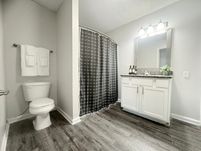 Spacious Bathroom with Granite Countertop