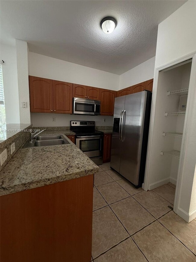 Building Photo - 17640 NW 73rd Ave Unit 200-19
