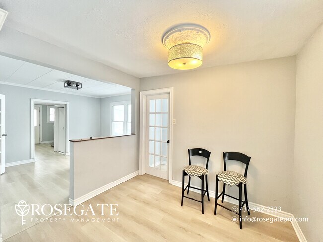 Photo - Spacious 4-Bedroom Main-Level Apartment with Private Backyard & Parking in London Unit 1