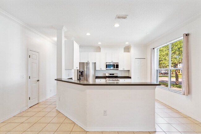 Move-in Ready Home with 2 Car Garage in Desirable Summerport Community!