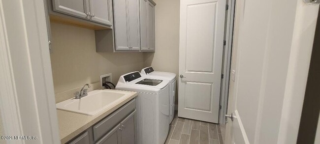 Photo - 4 bedroom home with 3 car garage In gated community