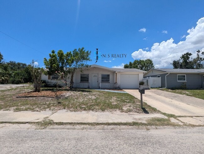 Photo - Must See 3/2/1 over 1000sf with tile/laminate floors, fresh paint, fenced yard and large living r...