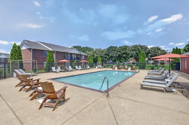 Community swimming pool with an expansive sundeck designed for recreation and relaxation.