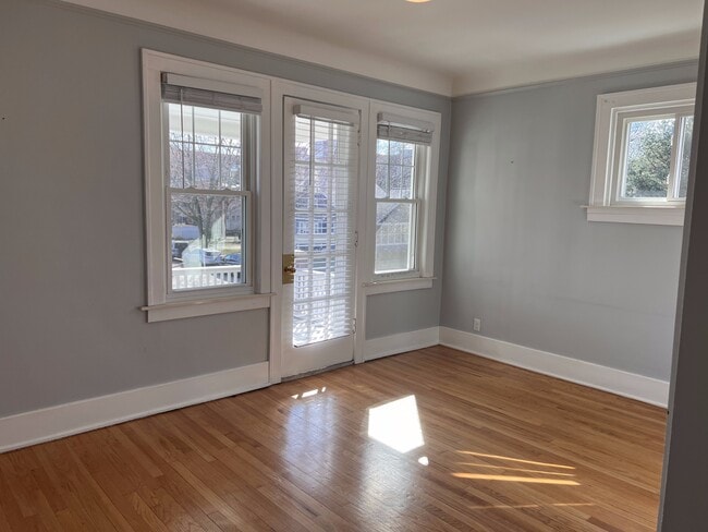 Living room with door to deck. - 210 S Laurel St Unit 3