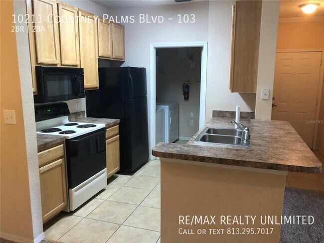 Photo - 10211 Courtney Palms Blvd Unit 103