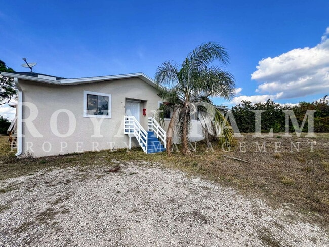 Photo - 4 Bedrooms, 2 Bathrooms & a Huge Backyard — Spacious Lehigh Acres Home with Pet-Friendly Living o...