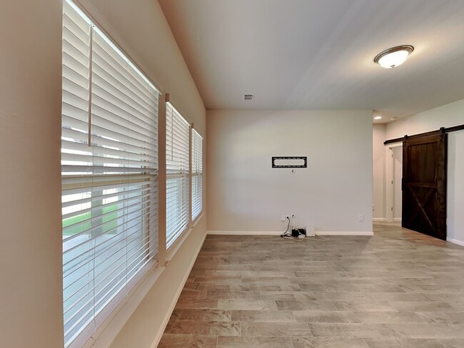 Photo - Chapel Creek Beauty with Designer Kitchen, Spacious Layout & Private Backyard Retreat!