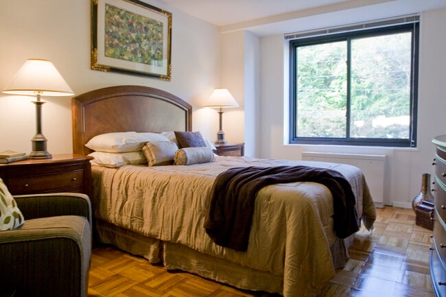 Bedroom with parquet flooring