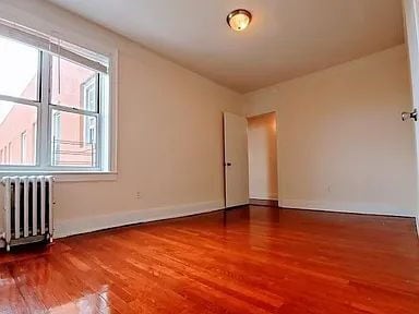 Photo - "Charming 1-Bed Oasis in the Heart of Woodside, NY!"