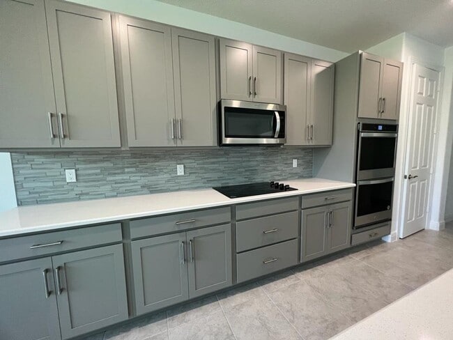 Photo - This Charming Brand-New Home is a 4/3 with...