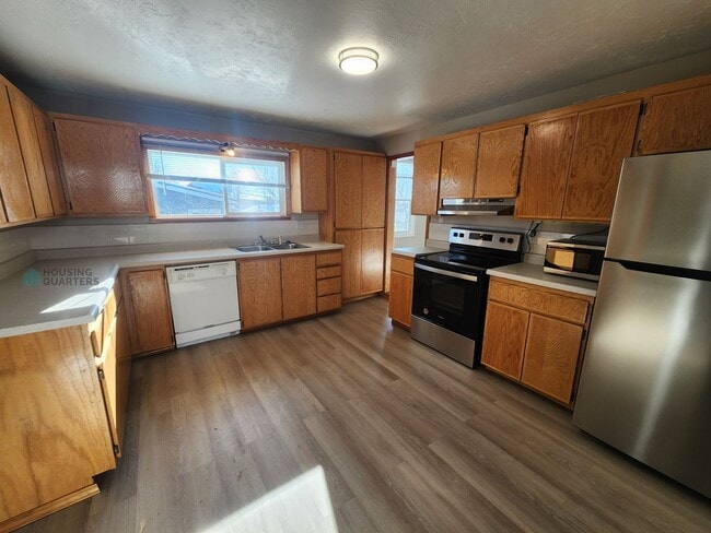 Photo - This 3-bed, 1-bath home features original woodwork, a covered front porch, a fenced yard, and an ...