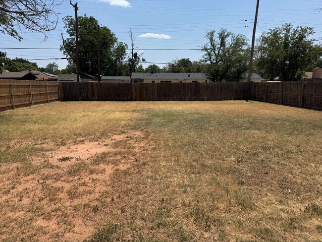 Updated 3 bedroom one bath home with a shade tree and large yard.