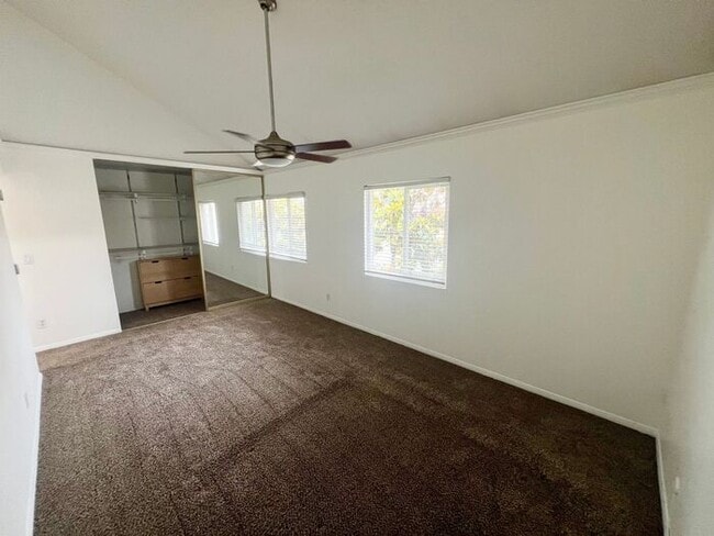 Photo - Stunning 4BR Townhome with Hardwood Floors, Private Patio, Community Pool & 2-Car Garage!