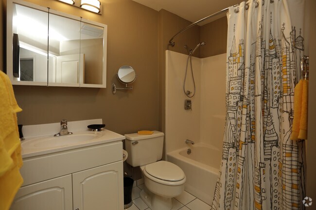 Curved Shower Curtain Rods, Hand-held Sprayers, and Makeup/Shaving Mirrors in Every Bathroom