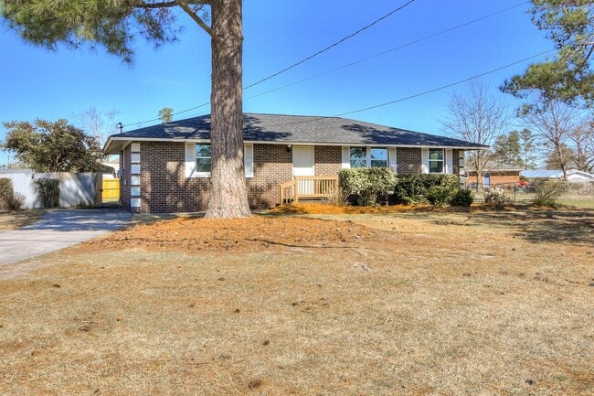 Photo - Charming 3-Bedroom, 2-Bath Home on a Corner Lot with Spacious Backyard