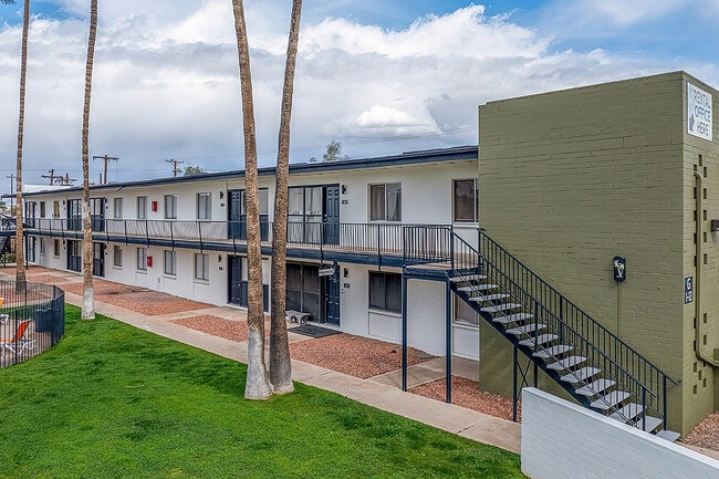 Building exterior with balconies - Palms on 2nd