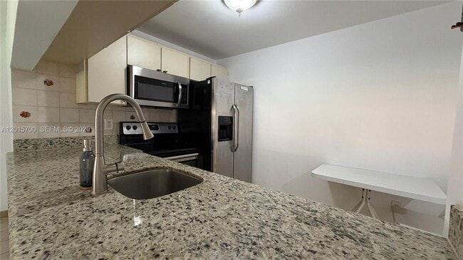 Building Photo - 6385 W 27th Ave Unit 11-3