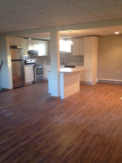 Large living area is open to the kitchen and entry. - 2305 Ash Ave Nw