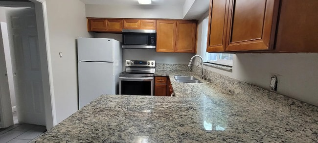 Building Photo - 6140 Gloria Dr Unit 18