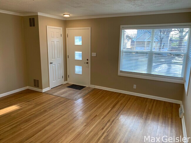 Cozy living room with view of family neighborhood. - 404 12th Ave N